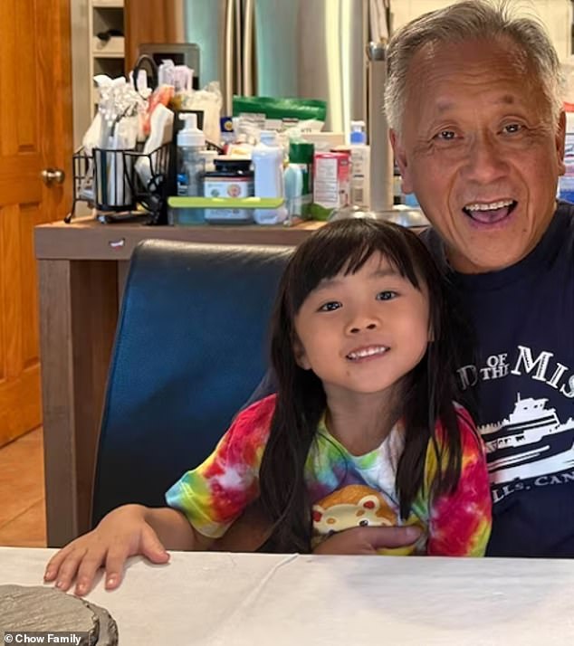 Astrid, 4, with her grandfather Adam Chow, 65, whom she called 'GongGong'. They were shot dead within seconds of each other by a gunman outside a Target in Austin