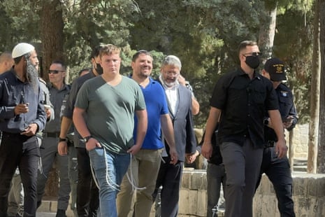 Israel’s far-right National Security Minister Itamar Ben-Gvir (third from right in Grey suit and white shirt) led a group to pray at the Al-Aqsa mosque