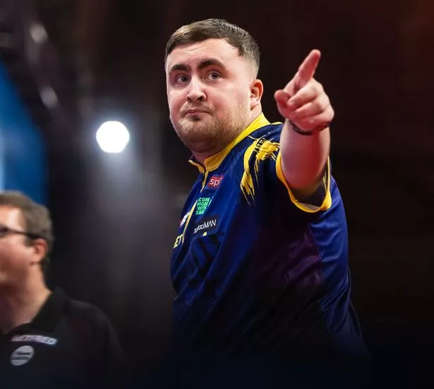 Luke Littler points to fans