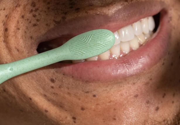 Person brushing their teeth