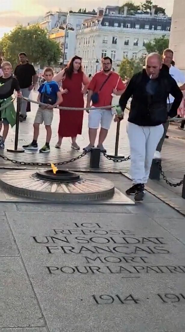 A man walking away from the eternal flame