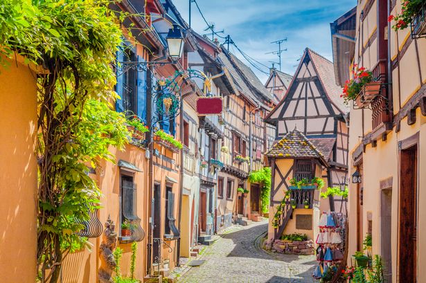 Image of Eguisheim showing colourful houses on a sunny day