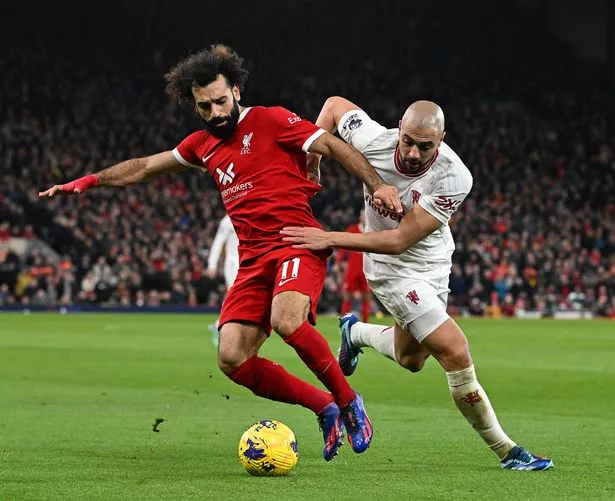Mohamed Salah of Liverpool with Sofyan Amrabat of Manchester United