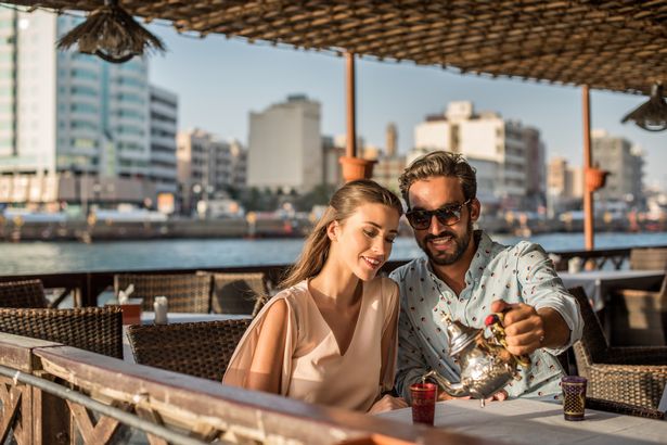 Image of a couple having dinner in sunny Dubai