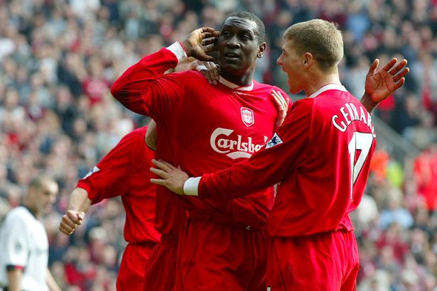 Liverpool's Emile Heskey celebrates scoring the opening goal against Fulham with teammate Steven Gerrard