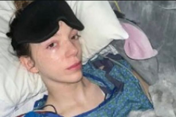 Charlotte Hollins Anderton lying on a bed