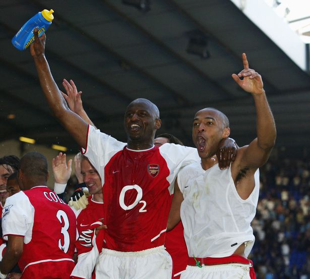 Thierry Henry and Patrick Vieira of Arsenal celebrates with team-mates at the end of the FA Barclaycard Premiership match between Tottenham Hotspur and Arsenal