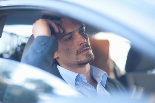 Upset driver waiting in traffic