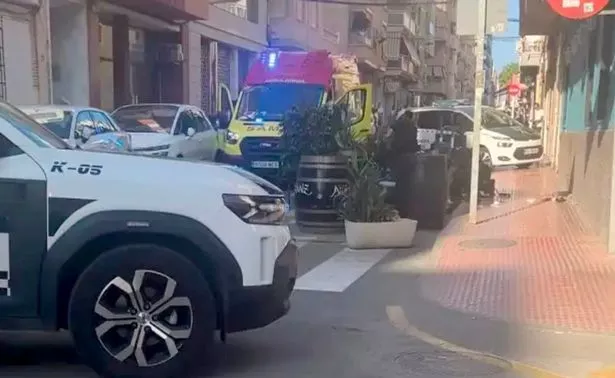 Police at the murder scene on Sunday evening