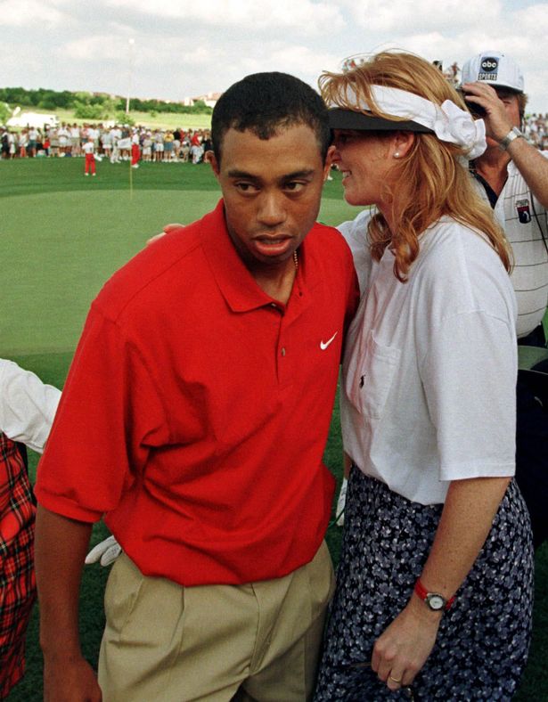 Tiger Woods gets a pat on the back from the former Duchess of York, Sarah Ferguson,