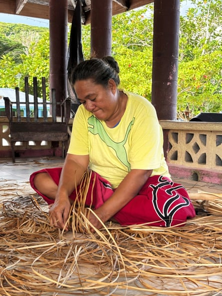 Tutogi Mua works on a fine mat.