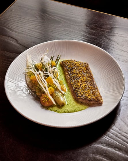 The Greyhound’s ‘gorgeously crisp-skinned’ sea bass with ‘a silky spin on beurre blanc’.