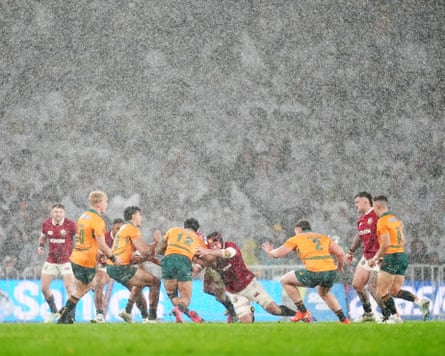 Heavy rain swamps the players 
