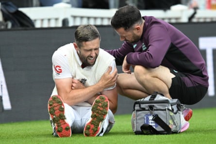 Chris Woakes after hurting his shoulder while trying to stop a boundary