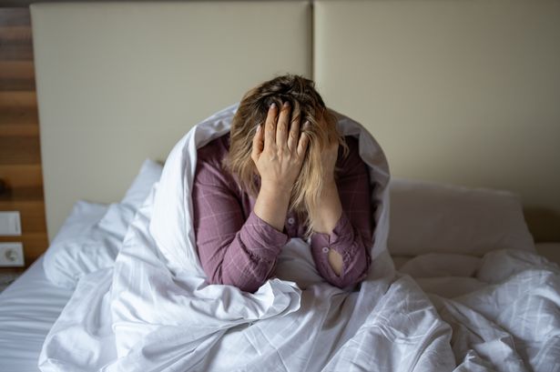 Person struggling to sleep