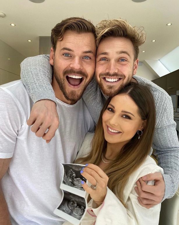 Ryan Libbey with Sam and Louise Thompson, who is holding up a baby scan