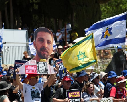 Israelis protest against plans to sack the attorney general outside the prime minister’s office in Jerusalem