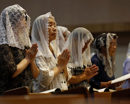 Churchgoers pray at the Urakami cathedral in Nagasaki.