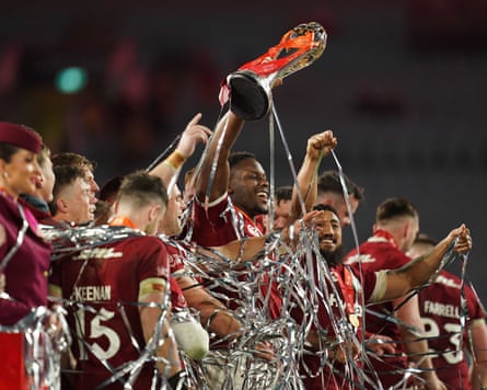 Maro Itoje lifts the series trophy, surrounded by other British & Irish Lions players