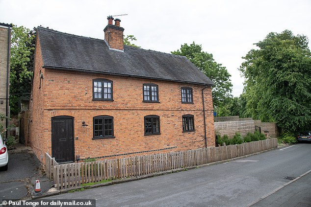 Matt Hubbard has lost his battle with the council and been ordered to lower the 'hideous' and 'ugly' eight-foot-high fence he built at his grade II listed home