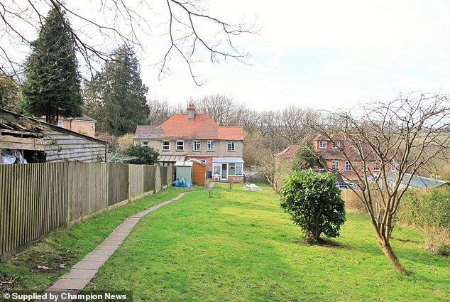 The disputed fence between the semi-detached properties as it was in 2015