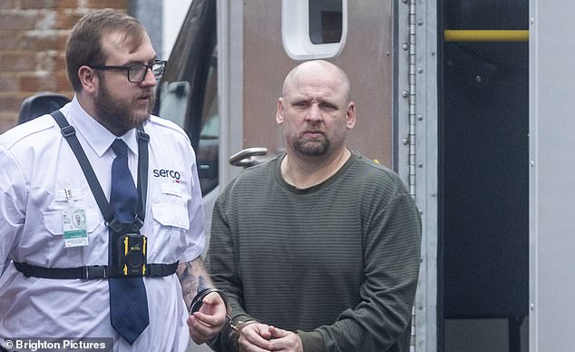 Mark Coates, 57, (centre) who tore the roof off the home of the people living next door in a bitter seven-year war over a garden fence has been released from prison after serving just three months of a four and a half year sentence