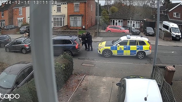 A witness told the Daily Mail a sniffer dog a sniffer dog examined the car before officers searched the boot.