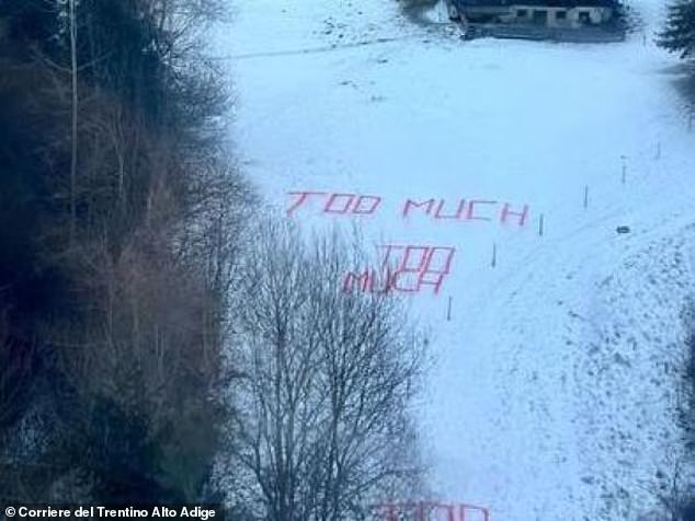 Anti tourists protestors told holidaymakers to go home by writing a slogan on a snow-covered slope in the Dolomites