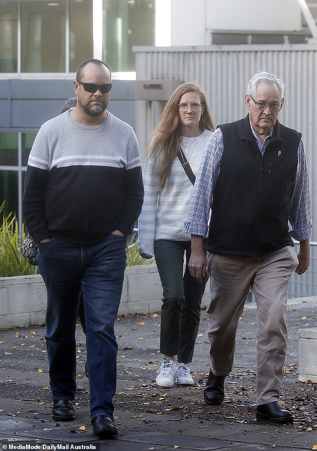 Survivor of the beef Wellington lunch, Ian Wilkinson (right) enters the Latrobe Valley law courts in Morwell during the trial in May