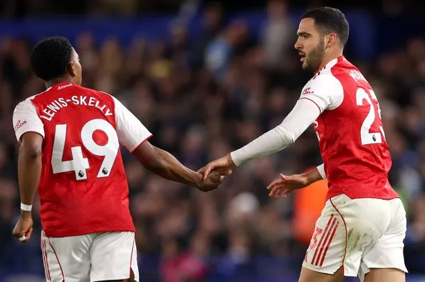 Mikel Merino of Arsenal celebrates scoring his team's first goal with teammate Myles Lewis-Skelly