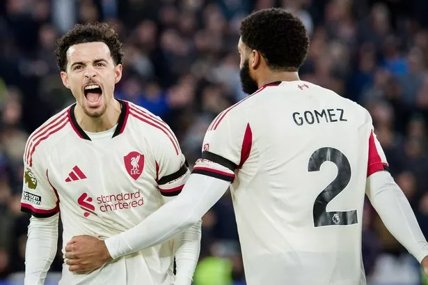 Curtis Jones and Joe Gomez celebrate.