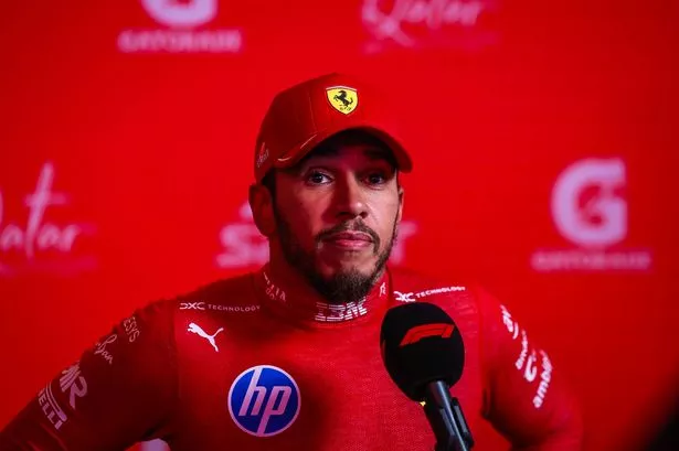 LUSAIL CITY, QATAR - NOVEMBER 28: Lewis Hamilton of Great Britain and Ferrari answers questions in the TV media pen during sprint qualifying ahead of the F1 Grand Prix of Qatar at Lusail International Circuit on November 28, 2025 in Lusail City, Qatar. (Photo by Jayce Illman/Getty Images)