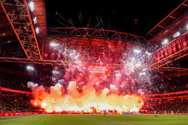 Ajax's clash with Groningen was abandoned after a fireworks display was set off inside the Johan Cruyff Arena