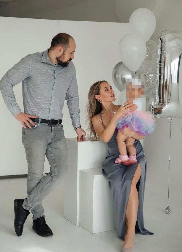 Andrei Kapustin, 32, with his wife and daughter