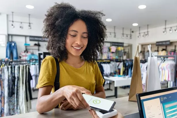 A woman paying for her shopping