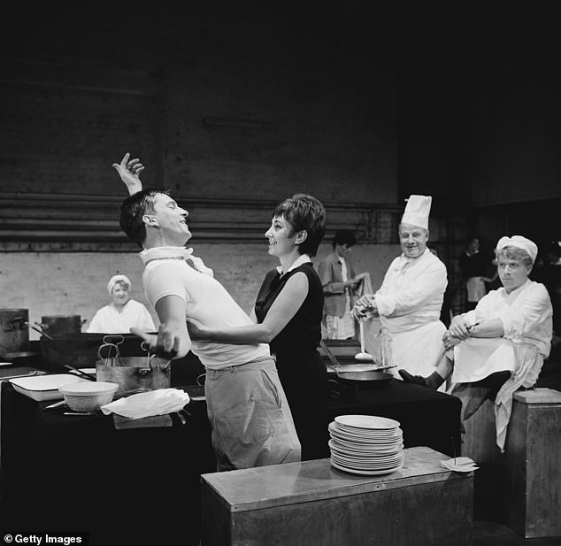 Jeremy Brett (1933 - 1995) and Sandra Caron during rehearsals for their play 'The Kitchen' at the Royal Court Theatre in London on August 21st, 1961