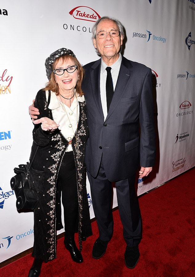 The couple had no children together, but the news of her death was reportedly announced by Brian's son, Marc (pictured in 2017 with Robert Klein)