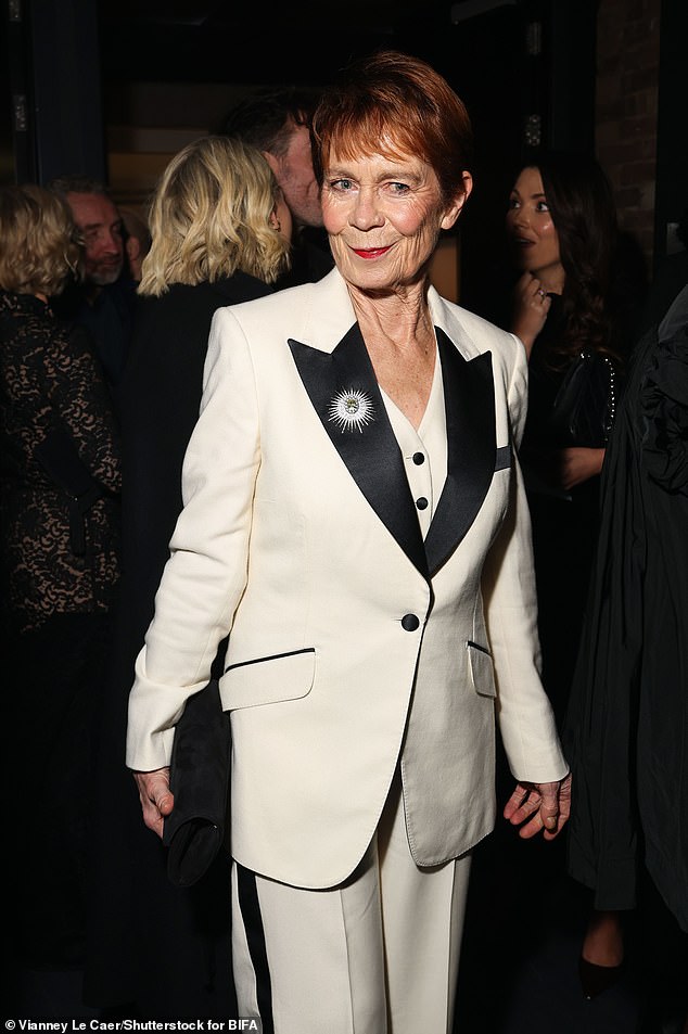 The actress wore an Atlas Carré Royal Solaris Brooch set with lab-grown diamonds and sapphire in grey gold on her white power suit
