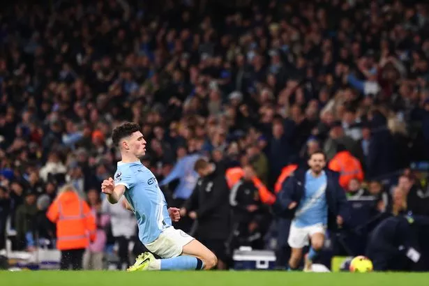 Phil Foden slides on his knees
