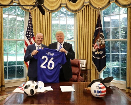 With Donald Trump at the Oval Office, 2018. They are holding a blue football shirt with the name ‘Trump’ on it and the number 26