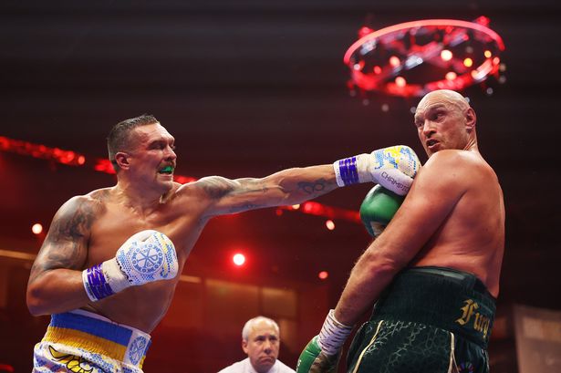 Oleksandr Usyk punches Tyson Fury