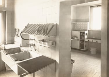 a black and white photo of a kitchen interior