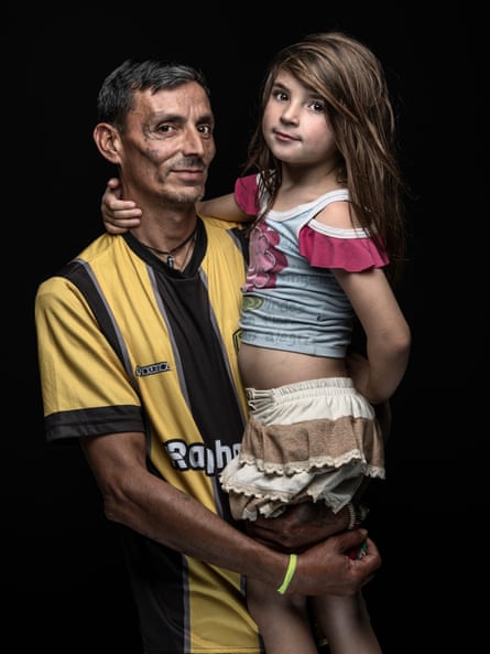 Pedro Luiz de Souza, a general services worker, and his daughter, Luizza, lost their home on the Ilha dos Marinheiros to flooding. T