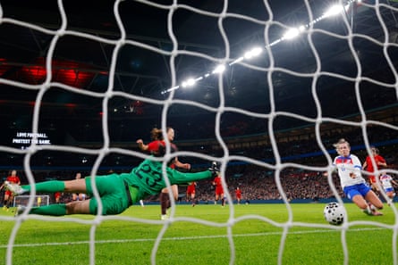 Lauren Hemp tucks the ball home for England’s third