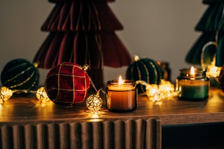 Christmas candles and decorations on a sideboard