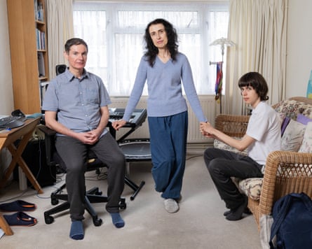 Guy and Oksana Shahar with their 15-year-old son Daniel in their front room