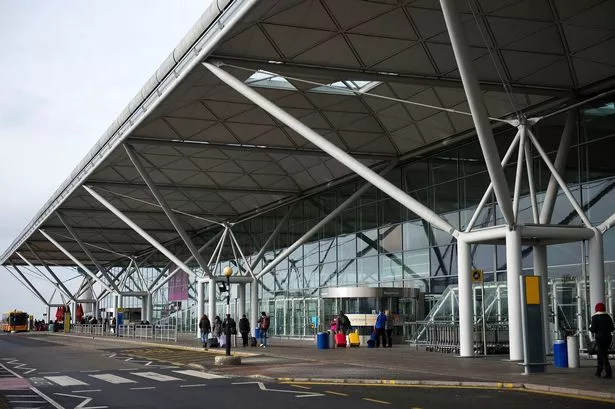 A former Premier League and England player was arrested at Stansted Airport on Sunday