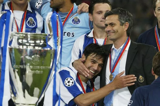 Nuno Valente of FC Porto hugs his manager Jose Dos Santos Mourinho