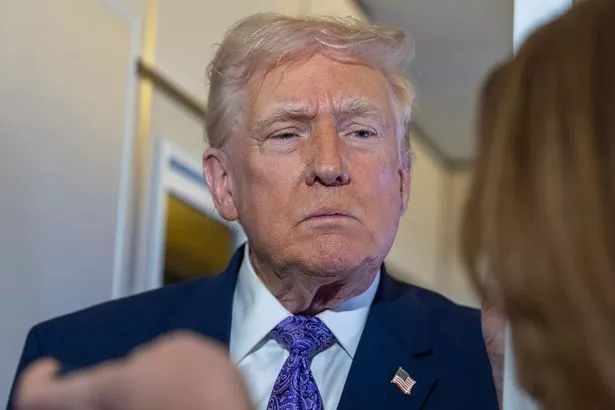 Trump speaking with reporters while in flight on Air Force One