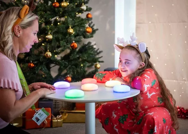 Esmai with Tŷ Hafan's Katie Simmons